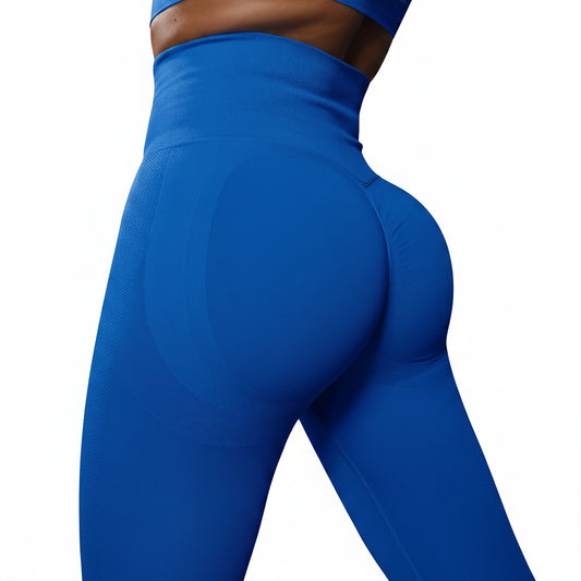Person wearing blue leggings on a white background
