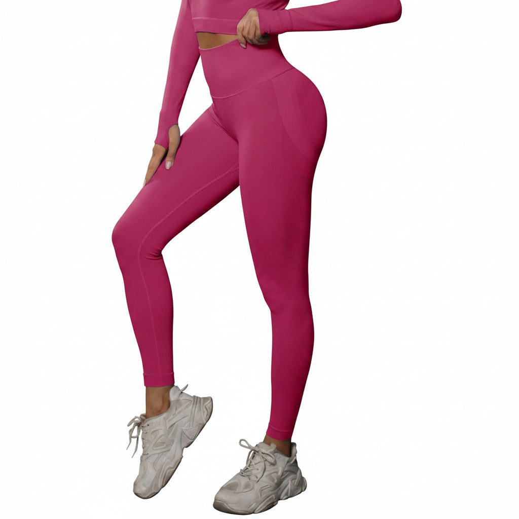 Person wearing a pink athletic outfit with white sneakers