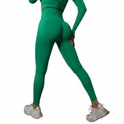 Person wearing green leggings and white sneakers
