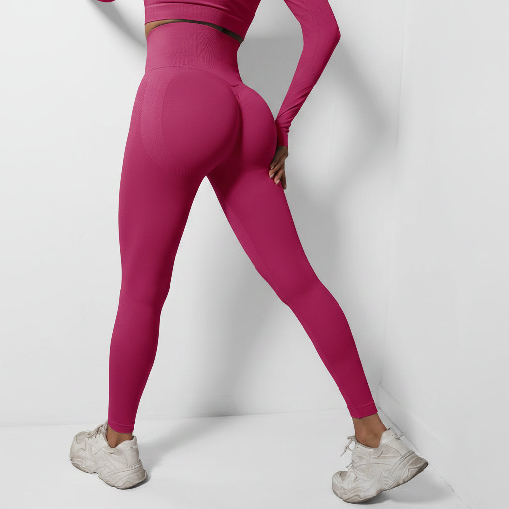 Person wearing bright pink leggings and white sneakers