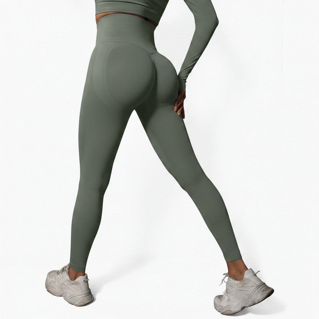 Person wearing green leggings and white sneakers