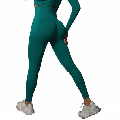Person wearing teal leggings and white sneakers