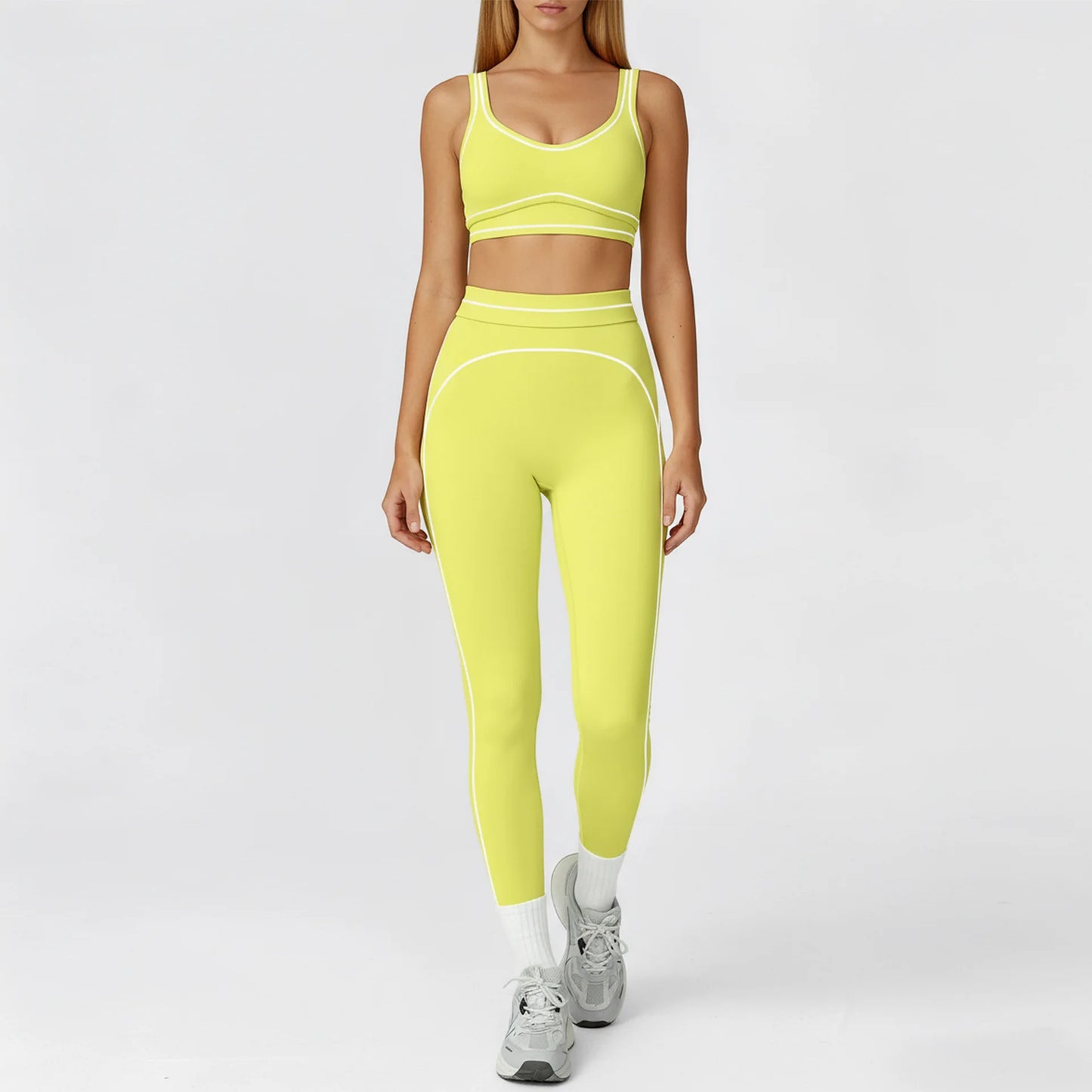 Person wearing a bright yellow athletic outfit on a white background