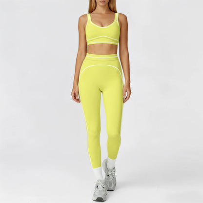 Person wearing a bright yellow athletic outfit on a white background
