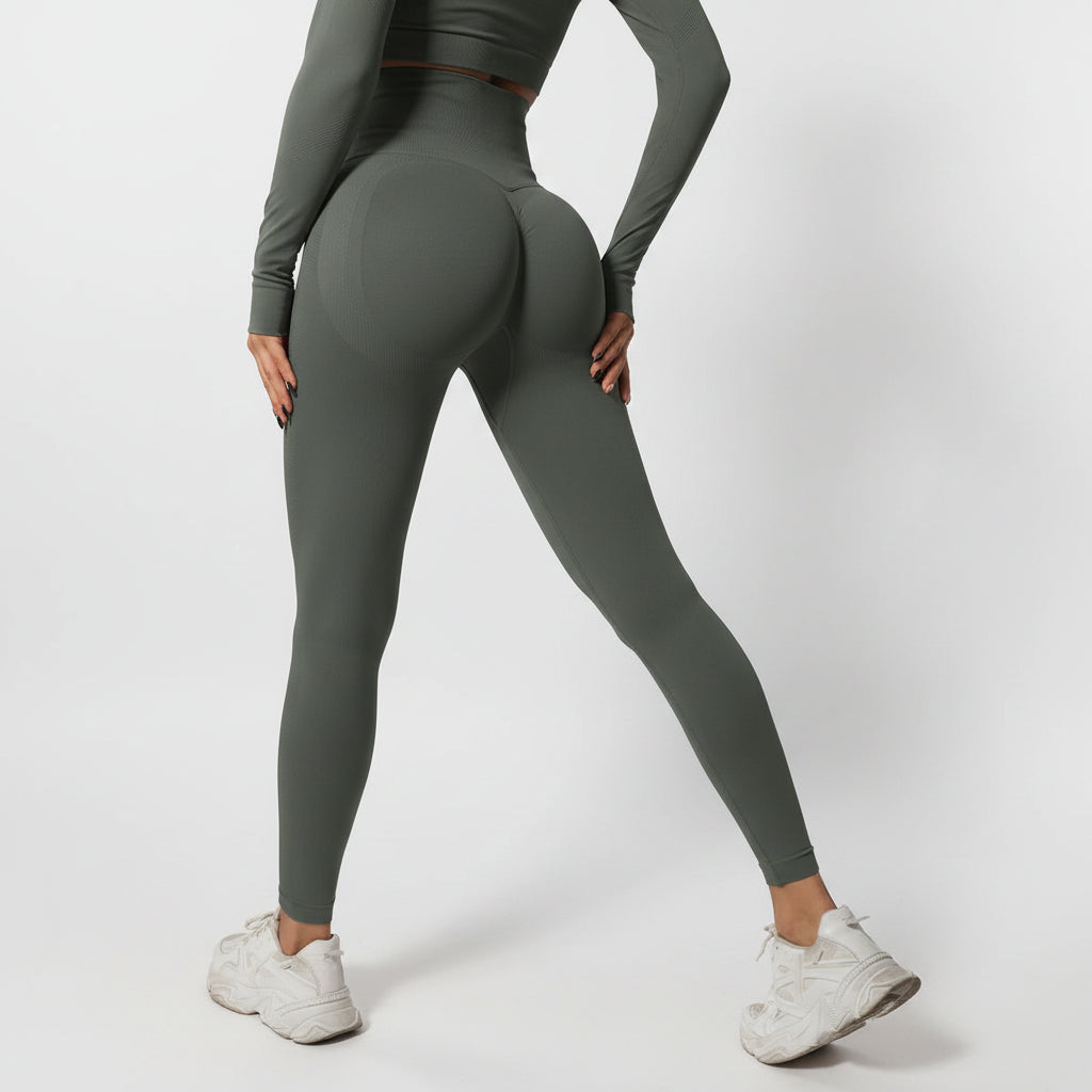 Person wearing green leggings and white sneakers