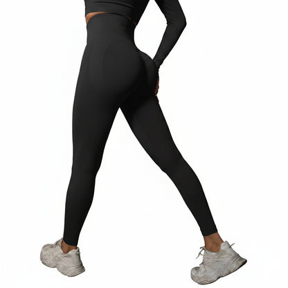 Person wearing black leggings and white sneakers 