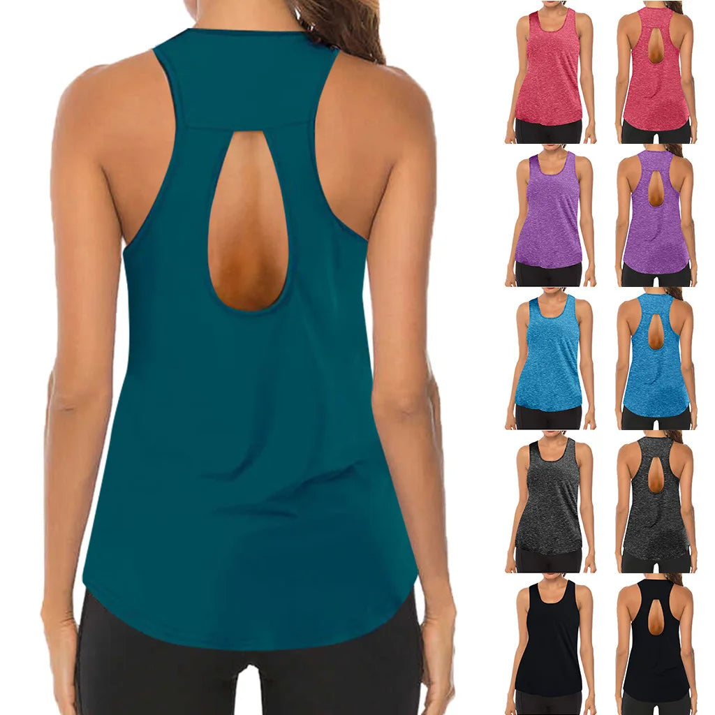 Woman wearing a teal tank top with an open back, surrounded by other tank tops in various colors.