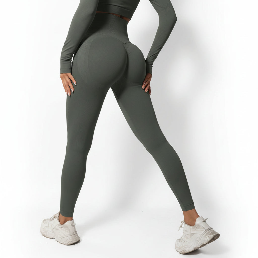 Person wearing green leggings and white sneakers