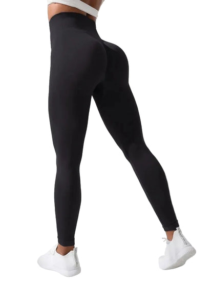 Person wearing black leggings with a white background