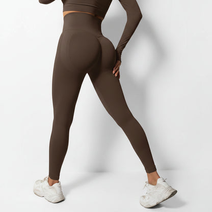 Person wearing brown leggings and white sneakers