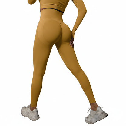 Person wearing mustard yellow leggings and white sneakers