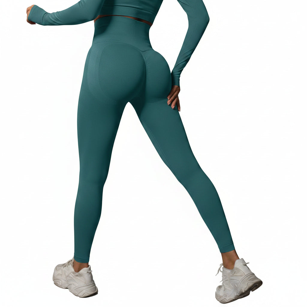 Person wearing teal leggings and white sneakers