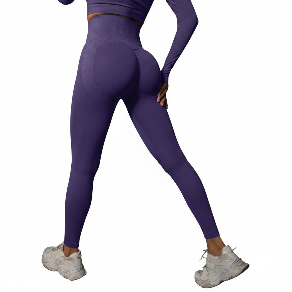 Person wearing purple athletic leggings and white sneakers