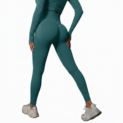 Person wearing teal leggings and white sneakers 