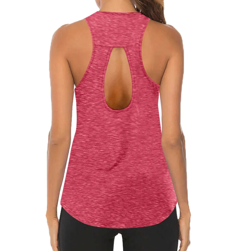 Pink tank top with open back worn by a person on a white background
