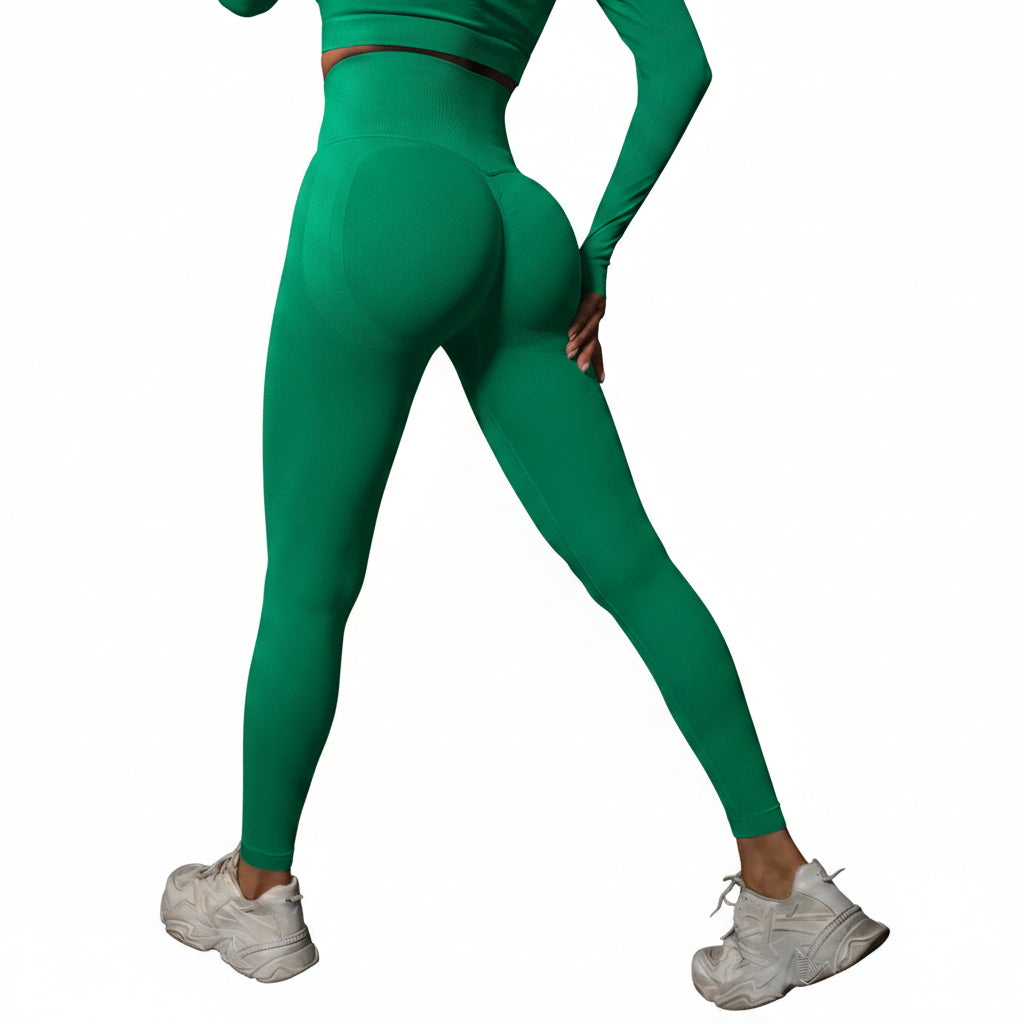 Person wearing green leggings and white sneakers