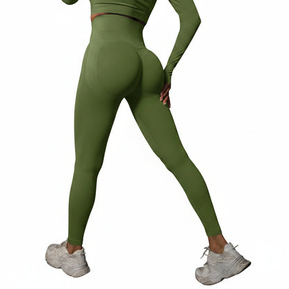 Person wearing green leggings and white sneakers
