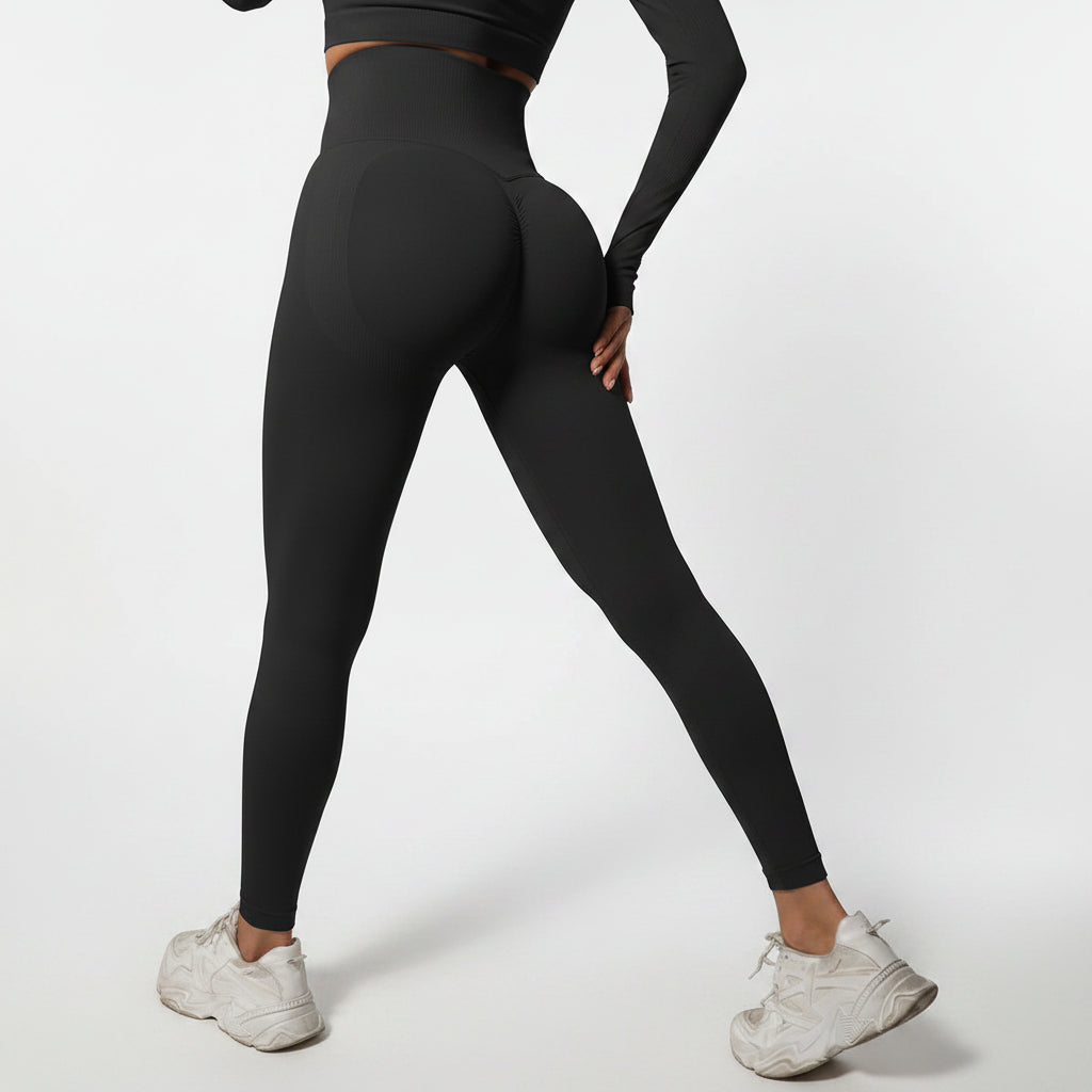 Person wearing black leggings and white sneakers