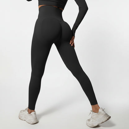 Person wearing black leggings and white sneakers
