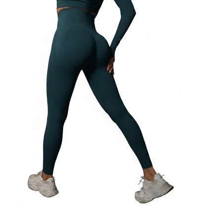 Person wearing teal leggings and white sneakers 