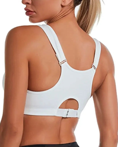 White sports bra worn by a person on a white background