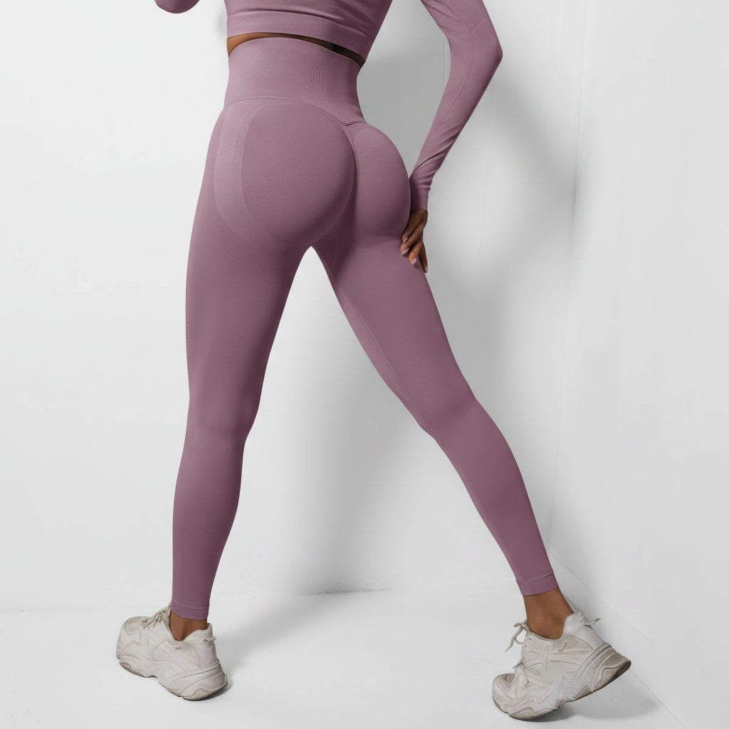 Person wearing purple leggings and white sneakers