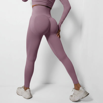 Person wearing purple leggings and white sneakers