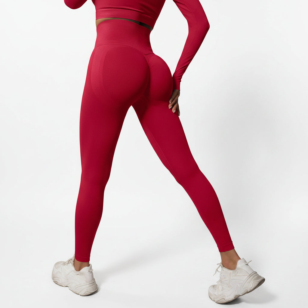 Person wearing red leggings and white sneakers