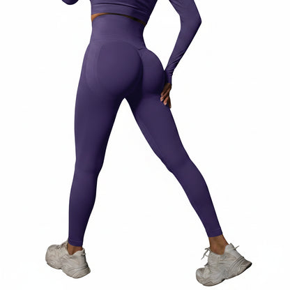 Person wearing purple athletic leggings and white sneakers