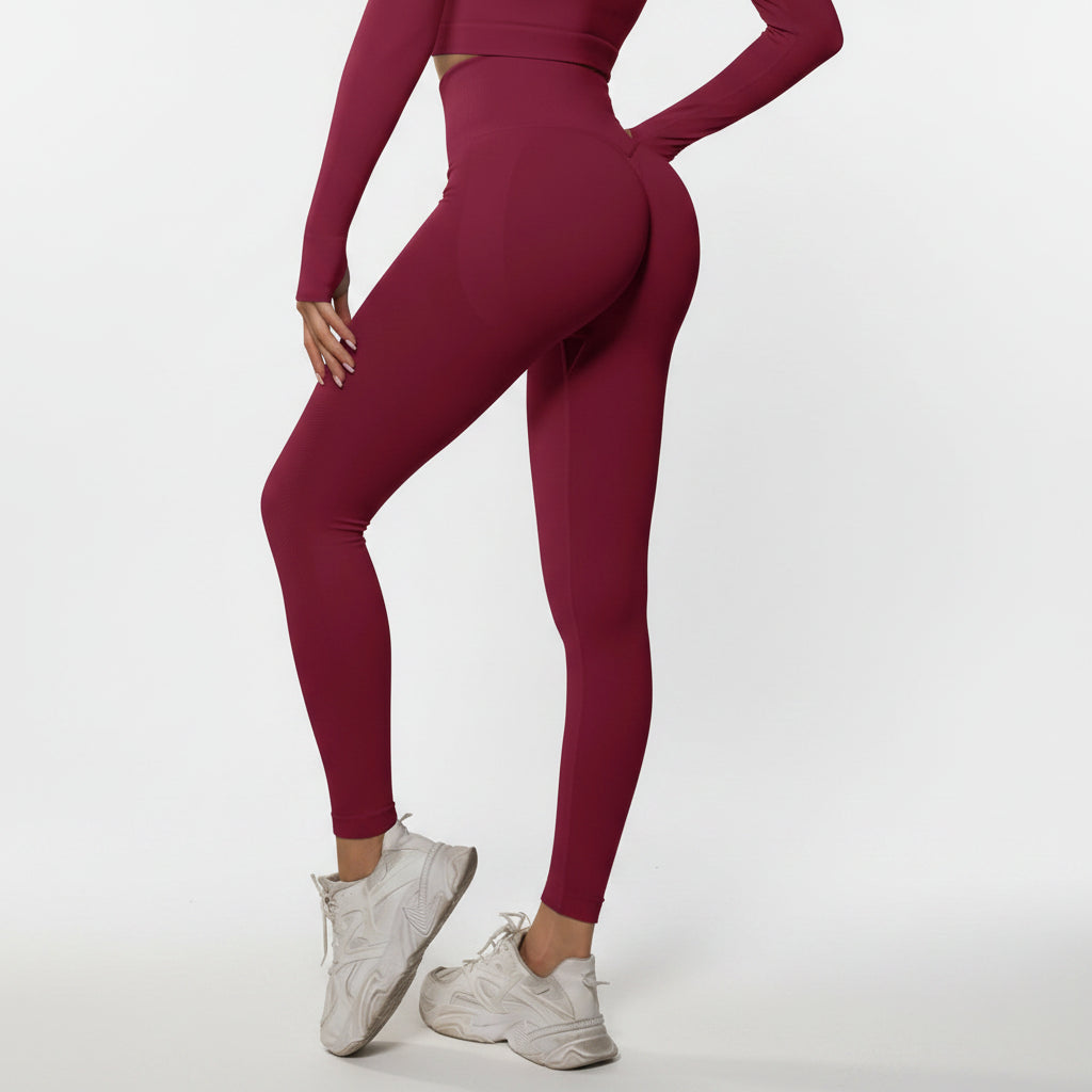 Person wearing a pink athletic outfit with white sneakers